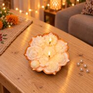 Chandni Off-White Floral Urli Candle - Rose-Scented Soy Wax by EKAA Candles (lit)