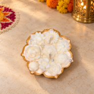 Off-white lotus urli candle in Diwali setting